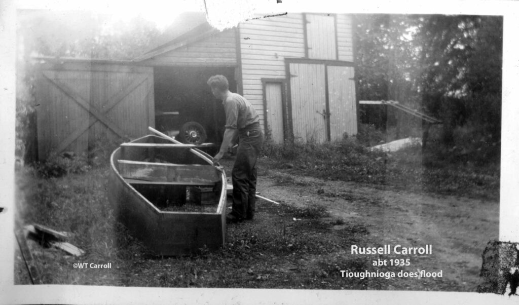 1935 Photo Russell Carroll repairing boat at 15 Tioughnioga Ave